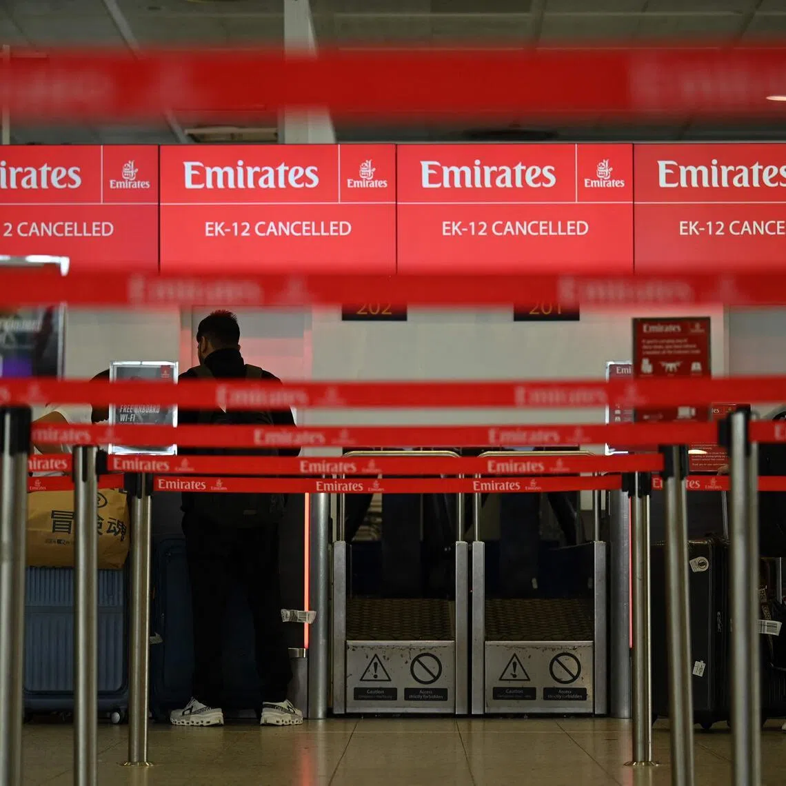 A check-in desk shows information on a cancelled flight at the London Gatwick Airport on Feb 28, 2026.
