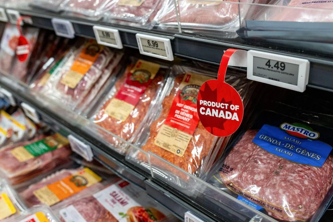 A Product of Canada sign near packaged meats at a grocery store in Langford, British Columbia, Canada.