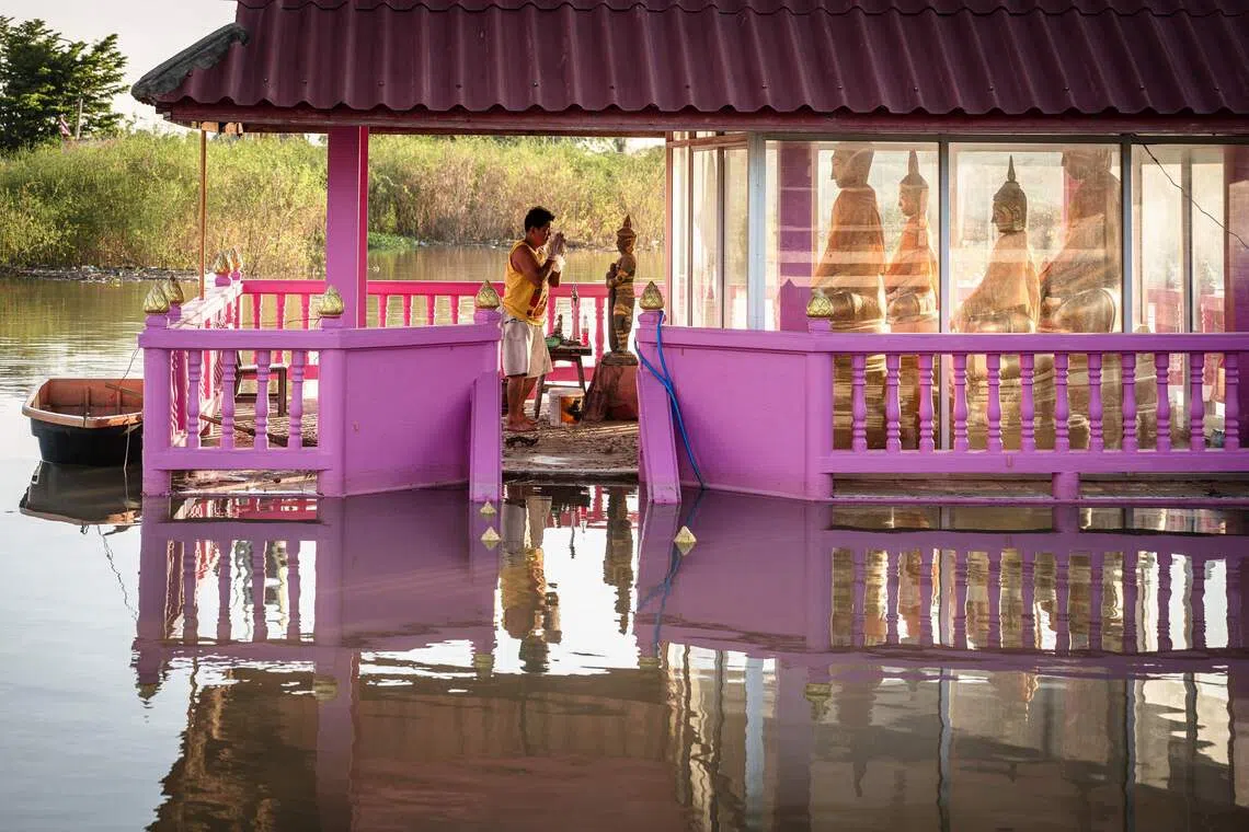 A Buddhist statue surrounded by floodwaters in Bang Ban district in the central Thai province of Ayutthaya.