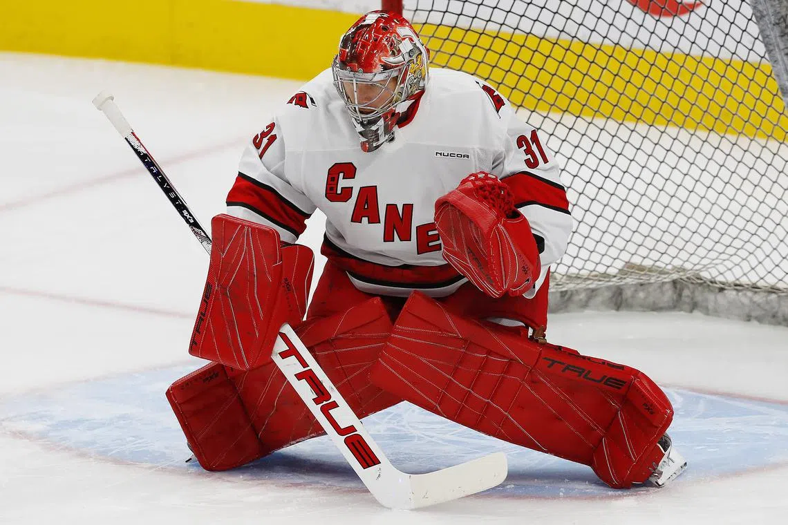 FILE PHOTO: Oct 22, 2024; Edmonton, Alberta, CAN; Carolina Hurricanes goaltender Frederik Andersen (31) makes a save on during warmup against the Edmonton Oilers at Rogers Place. Mandatory Credit: Perry Nelson-Imagn Images/File Photo
