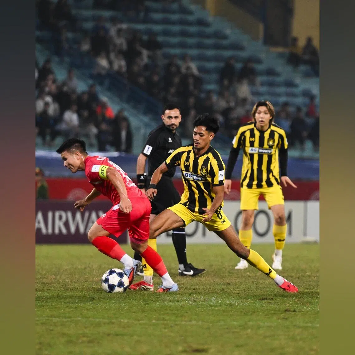 BG Tampines Rovers’ Shah Shahiran (centre) closing in on Cong An Ha Noi’s Nguyen Quang Hai as Seiga Sumi looks on during the first leg of their ACL2 round-of-16 tie on Feb 11 during the 2025-26 campaign.