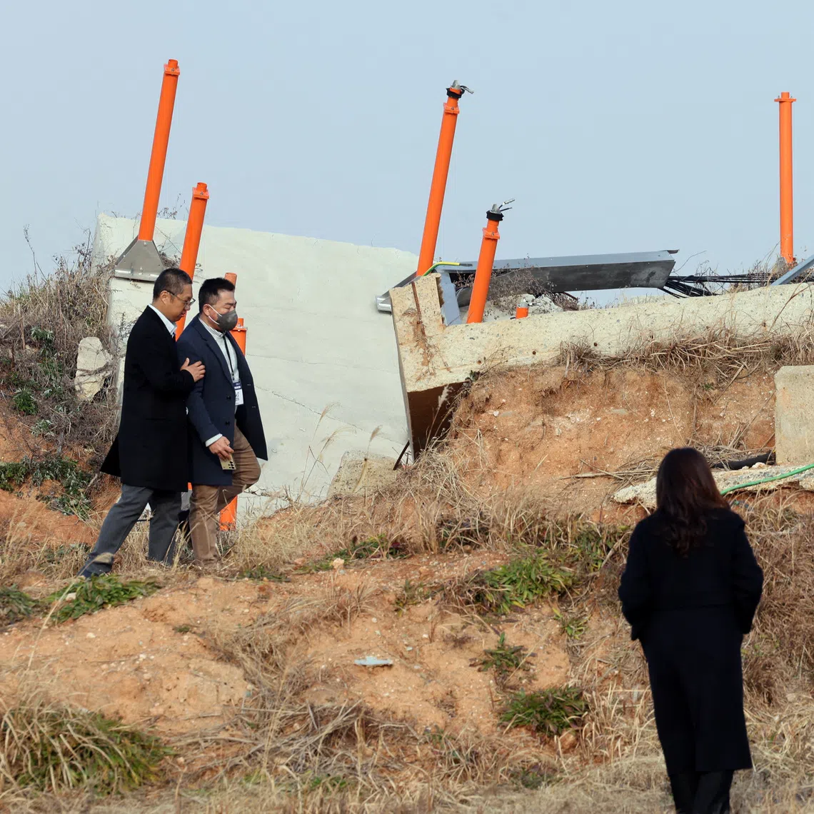 Bereaved family members at the site of the 2024 Jeju Air crash in Muan, South Korea, on Dec 29, the first anniversary of the disaster.