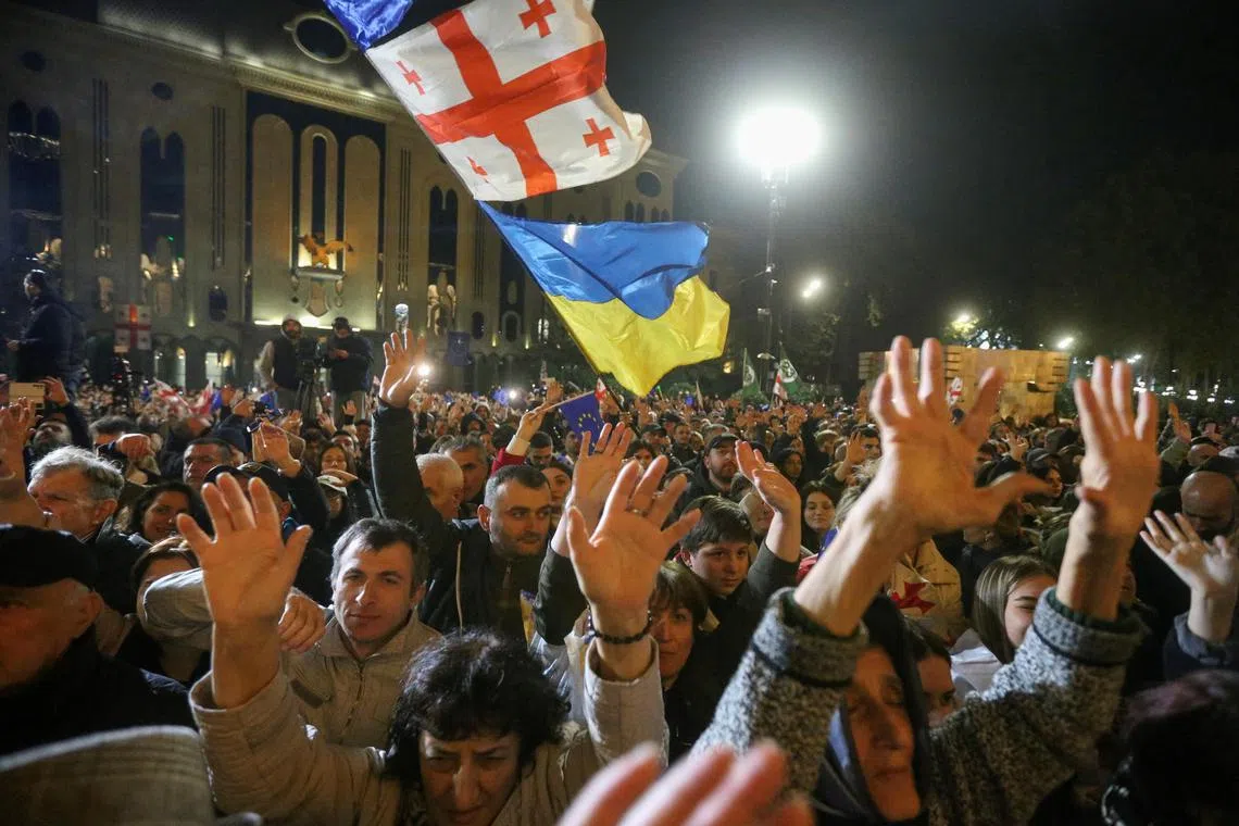 Supporters of Georgia's opposition parties holding a rally on Oct 28 in Tbilisi to dispute the result of the country's recent parliamentary election, which saw the ruling, pro-Russian Georgian Dream party win 53.92 per cent of the vote.