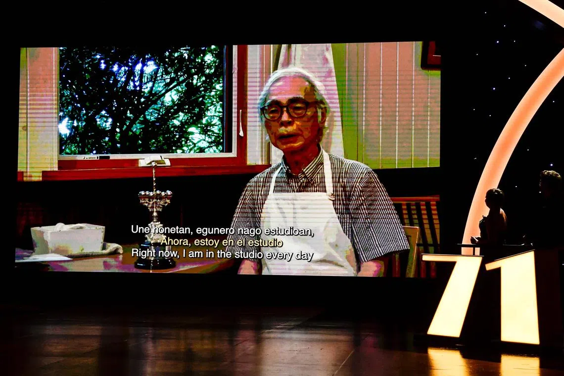 Oscar-winning Japanese animator Hayao Miyazaki appears on the screen expressing his gratitude to the festival for receiving the Donostia lifetime achievement award, in recognition of his prestigious film career, during the opening gala of the 71st edition of the San Sebastian Film Festival in the northern Spanish Basque city of San Sebastian on September 22, 2023. (Photo by ANDER GILLENEA / AFP)