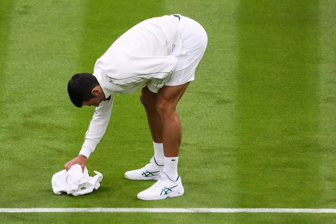 Novak Djokovic used a towel to rub the surface of the court to laughter from the crowd.