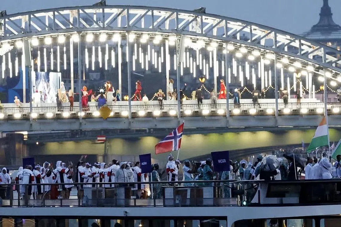 Performers on the Passerelle Debilly bridge during the opening ceremony.