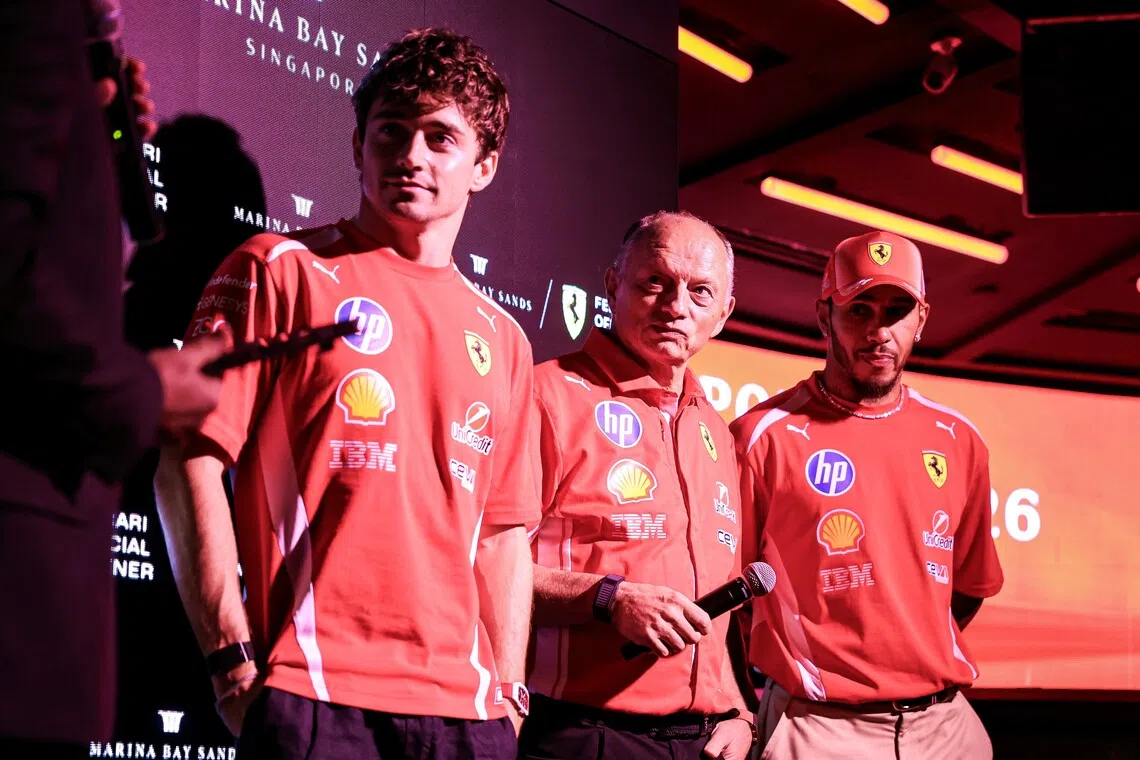 Ferrari drivers Lewis Hamilton (right) and Charles Leclerc, along with team principal Fred Vasseur (centre), speaking to guests at the Ferrari Cocktail Party at Marina Bay Sands on Oct 8.