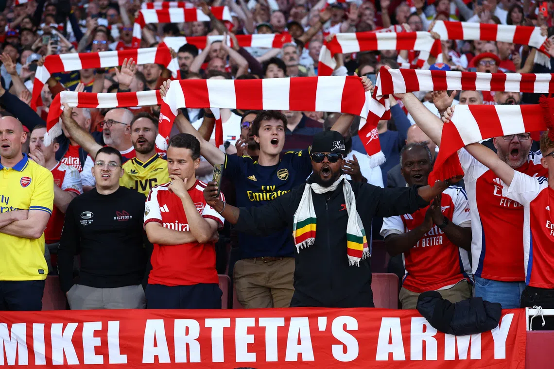 Soccer Football - Premier League - Arsenal v Coventry City - Emirates Stadium, London, Britain - August 21, 2026 Arsenal fans react inside the stadium before the match Action Images via Reuters/Peter Cziborra
