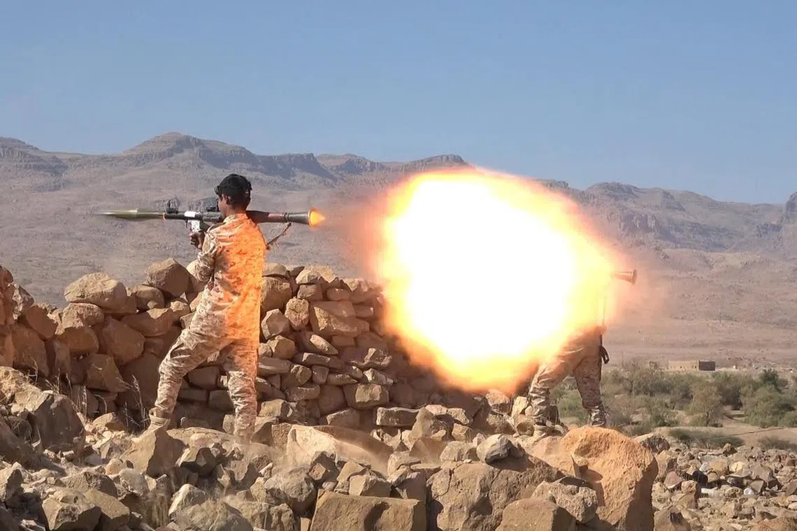Houthis rebels take part in a military exercise in Yemen, amid growing tensions with the United States.