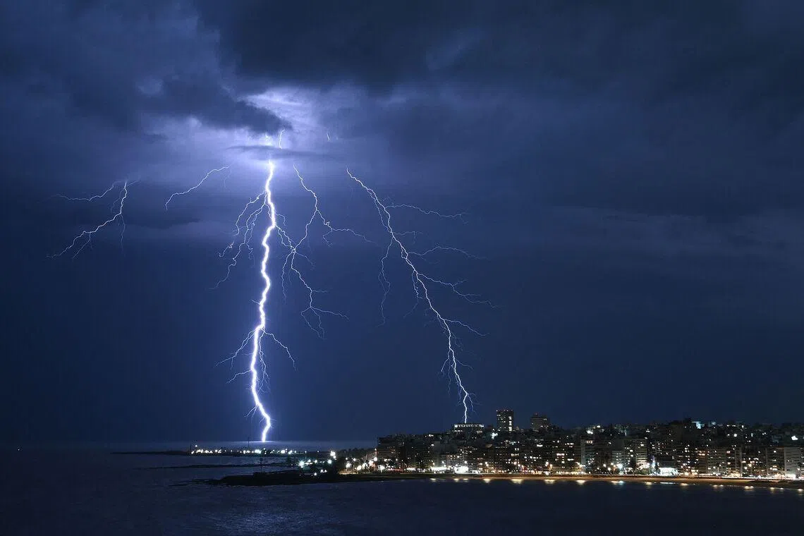 A streak of lightning lighting up the sky during a thunderstorm in Montevideo, Uruguay on Feb 23, 2026. 