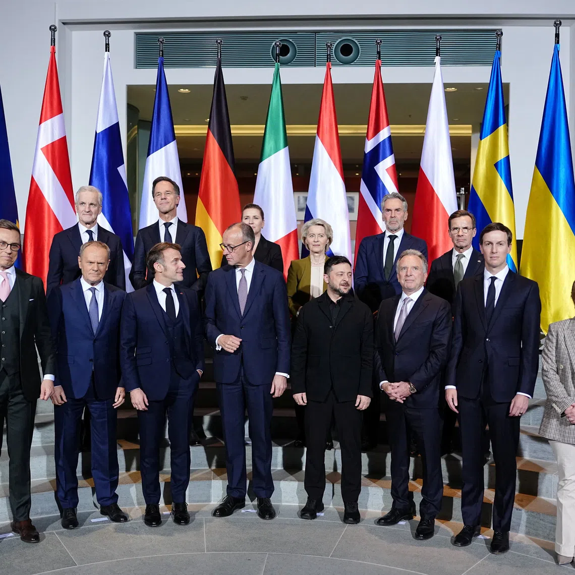 Finland's President Alexander Stubb, Polish Prime Minister Donald Tusk, French President Emmanuel Macron, German Chancellor Friedrich Merz, U.S. Special Envoy Steve Witkoff, businessman and former U.S. presidential adviser Jared Kushner, and Italian Prime Minister Giorgia Meloni, along with other European leaders, pose for a group photo at the Chancellery in Berlin, Germany, December 15, 2025. Kay Nietfeld/Pool via REUTERS