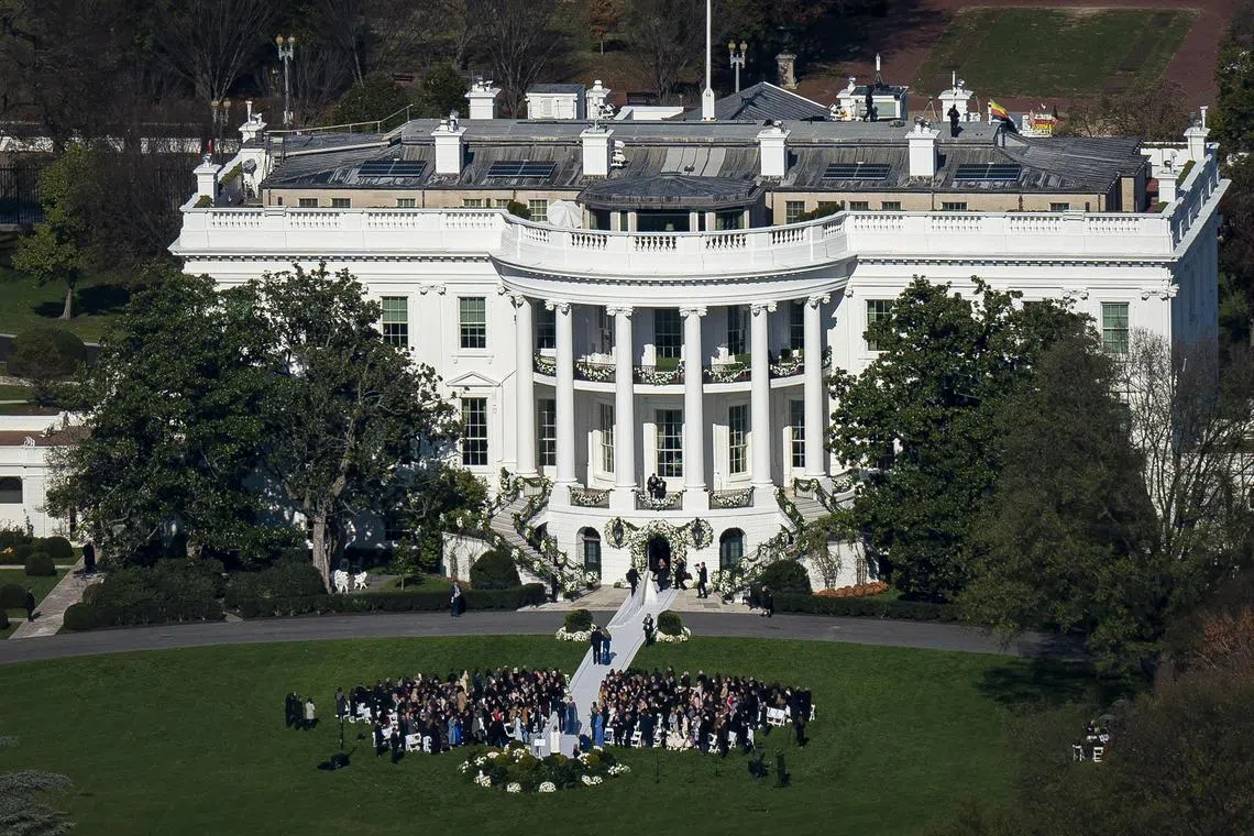 Guests gather on the South Lawn of the White House for the wedding of President Joe BidenÕs granddaughter, Naomi Biden, and Peter Neal, in Washington on Saturday, Nov. 19, 2022. When Tiffany Trump wed Michael Boulos at Mar-a-Lago and Naomi Biden wed Peter Neal at the White House, the nuptials may have starred two happy couples, but they also reflected the two different stories that former President Donald Trump and President Joe Biden tell the world about who they are Ñ about what they prize, the lives they have built. (Al Drago/The New York Times)