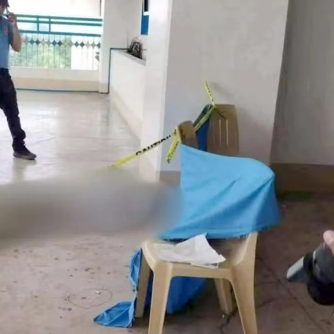 The police watch over the body of a Grade 10 student killed by his Grade 9 schoolmate, who fired guns inside the Ateneo de Zamboanga University in Zamboanga City, southern Philippines, on Aug 18.