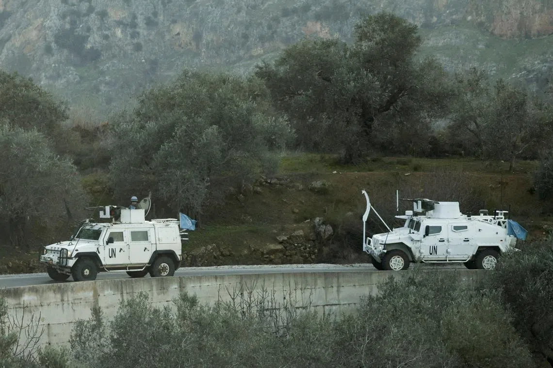 FILE PHOTO: UN peacekeepers (UNIFIL) vehicles ride along a street in Marjaayoun, Southern Lebanon January 20, 2025. REUTERS/Mohamed Azakir/File Photo