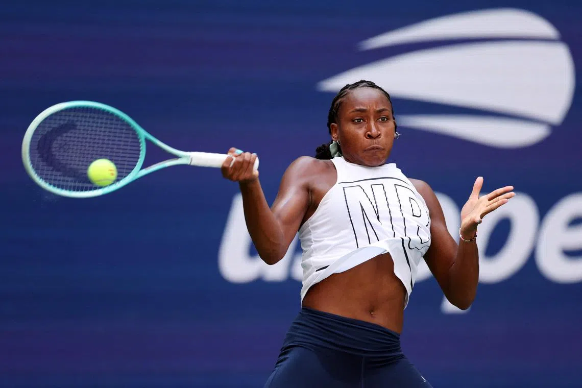 Coco Gauff returning the ball during a practice session prior to the start of the 2024 US Open.