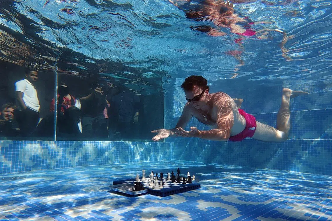FILE PHOTO: Chess - Grand Masters compete in Diving Chess Competition - Silo Hotel, Cape Town, South Africa - December 4, 2025 Hans Niemann of the U.S. in action REUTERS/Esa Alexander/File Photo