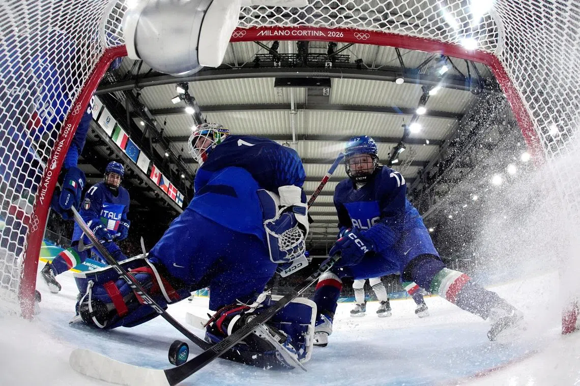 Milano Cortina 2026 Olympics - Ice Hockey - Women's Preliminary Round - Group B - Japan vs Italy - Milano Rho Ice Hockey Arena, Milan, Italy - February 09, 2026. Akane Shiga of Japan scores their second goal past Gabriella Durante of Italy and Matilde Fantin of Italy Pool via REUTERS/Hassan Ammar
