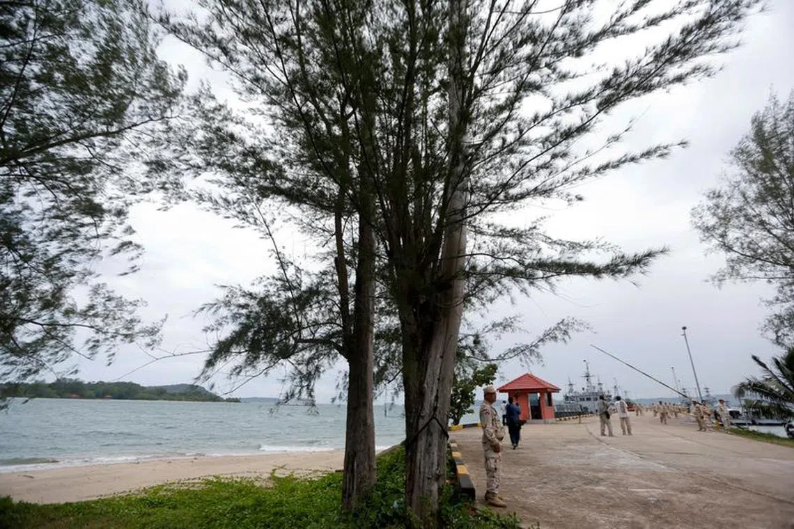 FILE PHOTO: Sailors stand guard near petrol boats at the Cambodian Ream Naval Base in Sihanoukville, Cambodia, July 26, 2019. REUTERS/Samrang Pring/File Photo