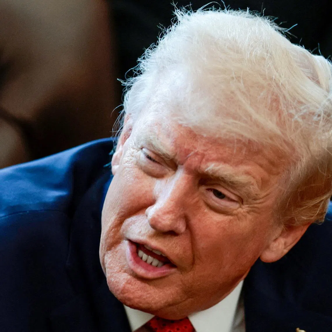 FILE PHOTO: U.S. President Donald Trump speaks in the Oval Office as he signs an executive order, at the White House in Washington, D.C., U.S., December 18, 2025. REUTERS/Evelyn Hockstein/File Photo