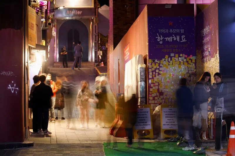 People walk through an alley in Itaewon where the Halloween crowd crush occurred.