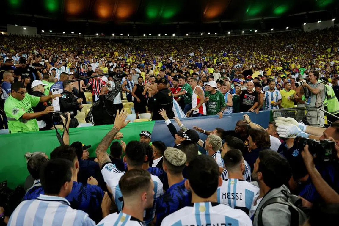 Soccer Football - World Cup - South American Qualifiers - Brazil v Argentina - Estadio Maracana, Rio de Janeiro, Brazil - November 21, 2023 Argentina's Lionel Messi and teammates speak to fans after clashes with security staff cause a delay to the start of the match REUTERS/Ricardo Moraes/File Photo
