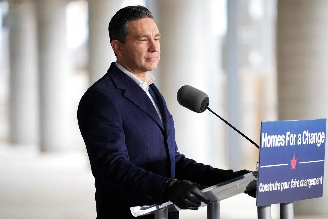 FILE PHOTO: Conservative Party of Canada's leader Pierre Poilievre speaks to the media inside an under-construction building during a campaign stop in Toronto, Ontario, Canada April 21, 2025. REUTERS/Arlyn McAdorey/File Photo