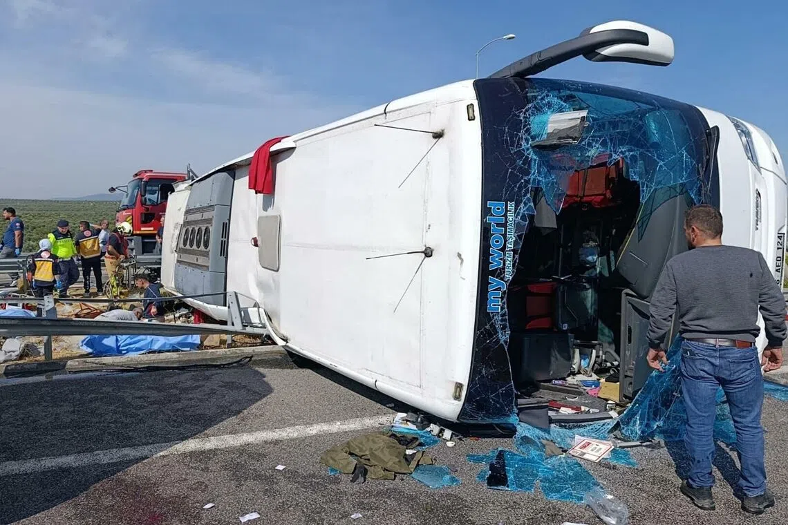 Fire department and first aid officials operating at the site, where a coach collided with a truck on Oct 11, in Manisa, west of Turkey.