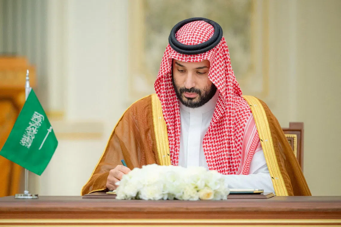 FILE PHOTO: Saudi Crown Prince Mohammed bin Salman signs a defence agreement next to Pakistan Prime Minister Shehbaz Sharif (not pictured) in Riyadh, Saudi Arabia, September 17, 2025. Saudi Press Agency/Handout via REUTERS