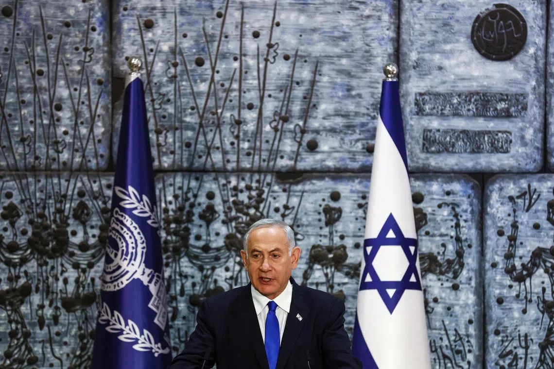 FILE PHOTO: Benjamin Netanyahu speaks during a ceremony where Israel President Isaac Herzog handed him the mandate to form a new government following the victory of the former premier's right-wing alliance in this month's election at the President's residency in Jerusalem November 13, 2022. REUTERS/ Ronen Zvulun/File Photo