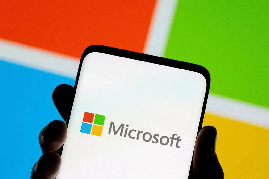 FILE PHOTO: Smartphone is seen in front of Microsoft logo displayed in this illustration taken, July 26, 2021. REUTERS/Dado Ruvic/Illustration/File Photo