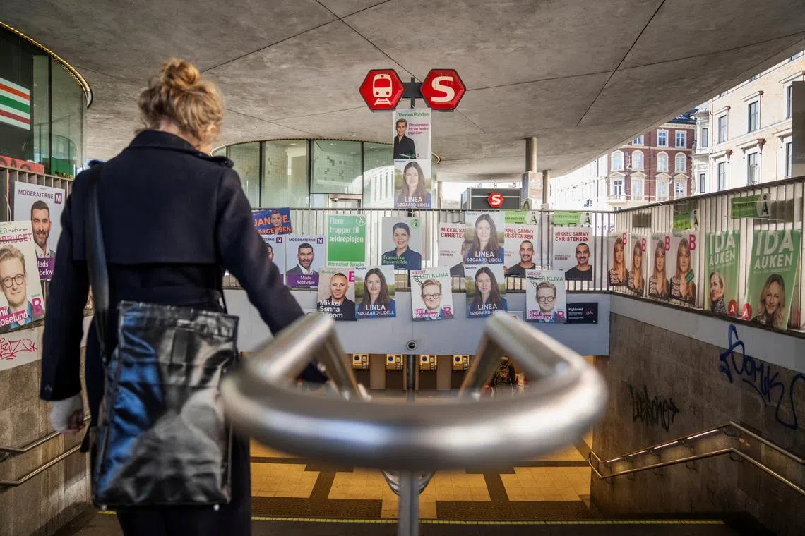 Election posters hang above the entrance of Noerreport Station in Copenhagen, Denmark, March 3, 2026. Ritzau Scanpix/Sebastian Elias Uth via REUTERS