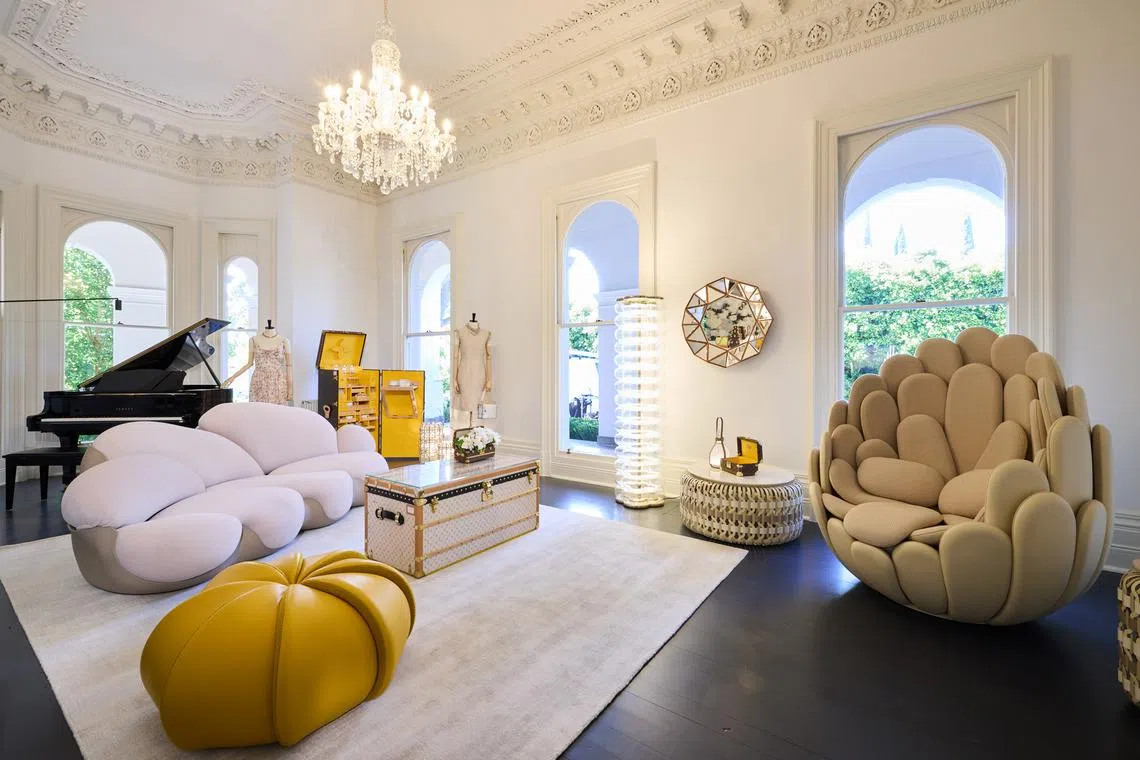 A luxury home setting in Melbourne of Louis Vuitton pieces including a Louis Vuitton trunk used as a coffee table, and travel-inspired furniture and objects from the Objets Nomades collection. 