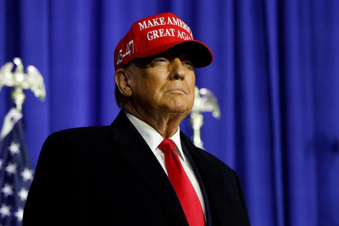 FILE PHOTO: Former U.S. President Donald Trump looks on at a campaign event in Waterford Township, Michigan, U.S., February 17, 2024.  REUTERS/Rebecca Cook/FILE PHOTO