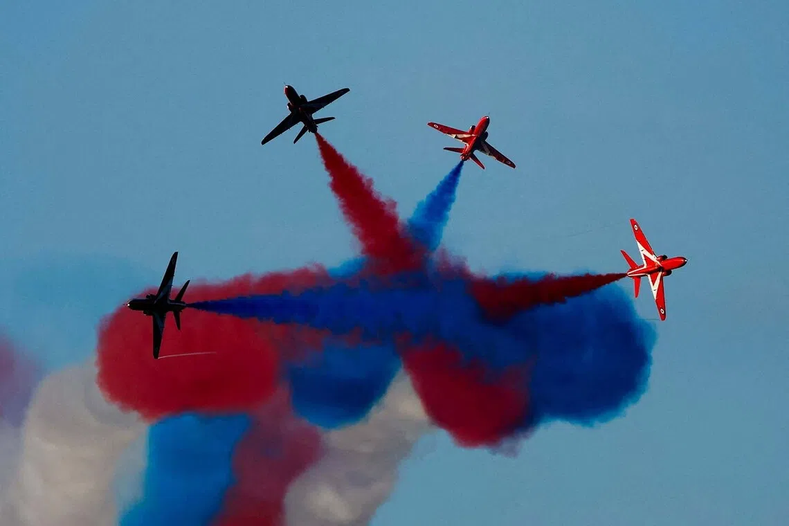 The British Royal Air Force Red Arrows aerobatics team performing with their BAE Systems Hawk T1 aircraft at the Malta International Airshow in Qawra, Malta, Sept 28, 2025. 