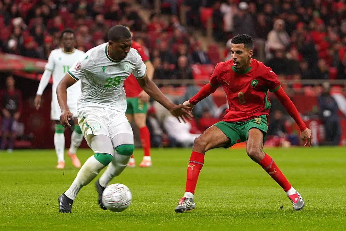 Soccer Football - CAF Africa Cup of Nations - Morocco 2025 - Group A - Morocco v Comoros - Prince Moulay Abdellah Stadium, Rabat, Morocco - December 21, 2025 Comoros' Zaydou Youssef in action with Morocco's Azzedine Ounahi REUTERS/Stringer