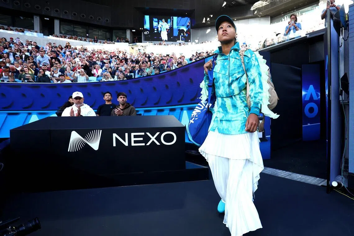 Japan's Naomi Osaka walks on the court to face Romania's Sorana Cirstea at the Australian Open.