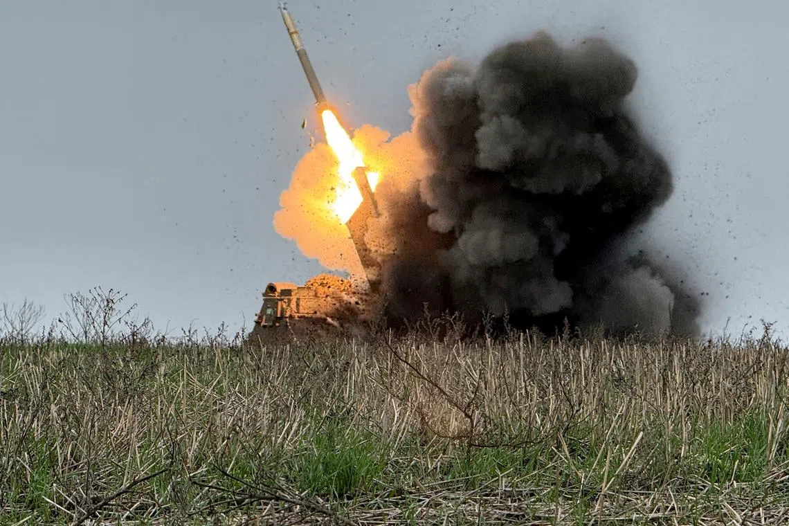 FILE PHOTO: Ukrainian servicemen fire a Multiple Launch Rocket System (MLRS) towards Russian troops, amid Russia's attack on Ukraine, near the frontline town of Pokrovsk in Donetsk region, Ukraine December 9, 2025. REUTERS/Stringer/File Photo