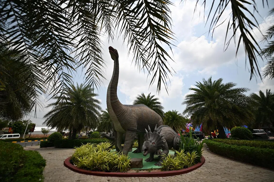 ST20230504-202309838272-Lim Yaohui-pixseagames05/
Dinosaur sculptures at the entrance of dinosaur park, where indoor hockey is at dinosaur park hall in Phnom Penh, Cambodia on May 4, 2023. 
Coverage of the 32nd Southeast Asian Games 2023 in Cambodia from 5 to 17 May 2023.
(ST PHOTO: LIM YAOHUI)