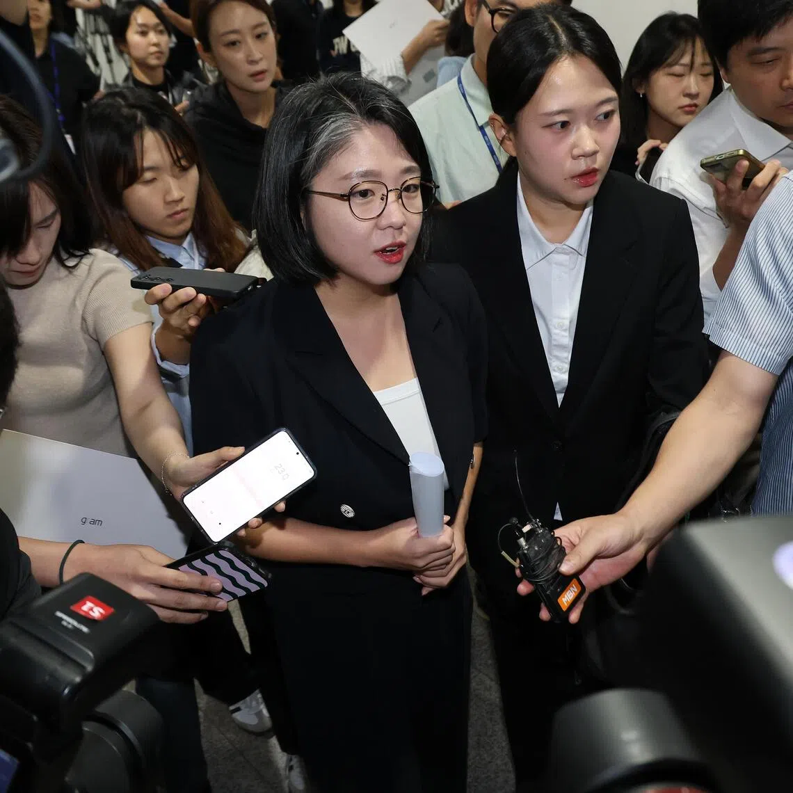 South Korea’s gender minister nominee Yong Hye-in (centre left) leaving the National Assembly after announcing her withdrawal on Sept 13.
