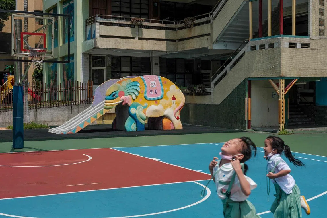 This photo taken on September 10, 2024 shows an elephant slide at an elementary school in New Taipei City. In playgrounds across Taiwan a jumbo surprise awaits children in the form of colourful elephant slides, evoking nostalgia for older Taiwanese who say these structures used to be ubiquitous across the island. (Photo by Yan ZHAO / AFP) / TO GO WITH AFP STORY Taiwan-culture-children by Yan ZHAO