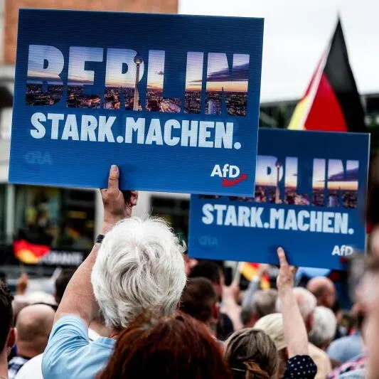 Supporters of the far-right Alternative for Germany (AfD) party holding signs saying ‘Make Berlin Strong’ during a rally on June 29 in front of the Berlin City Hall.