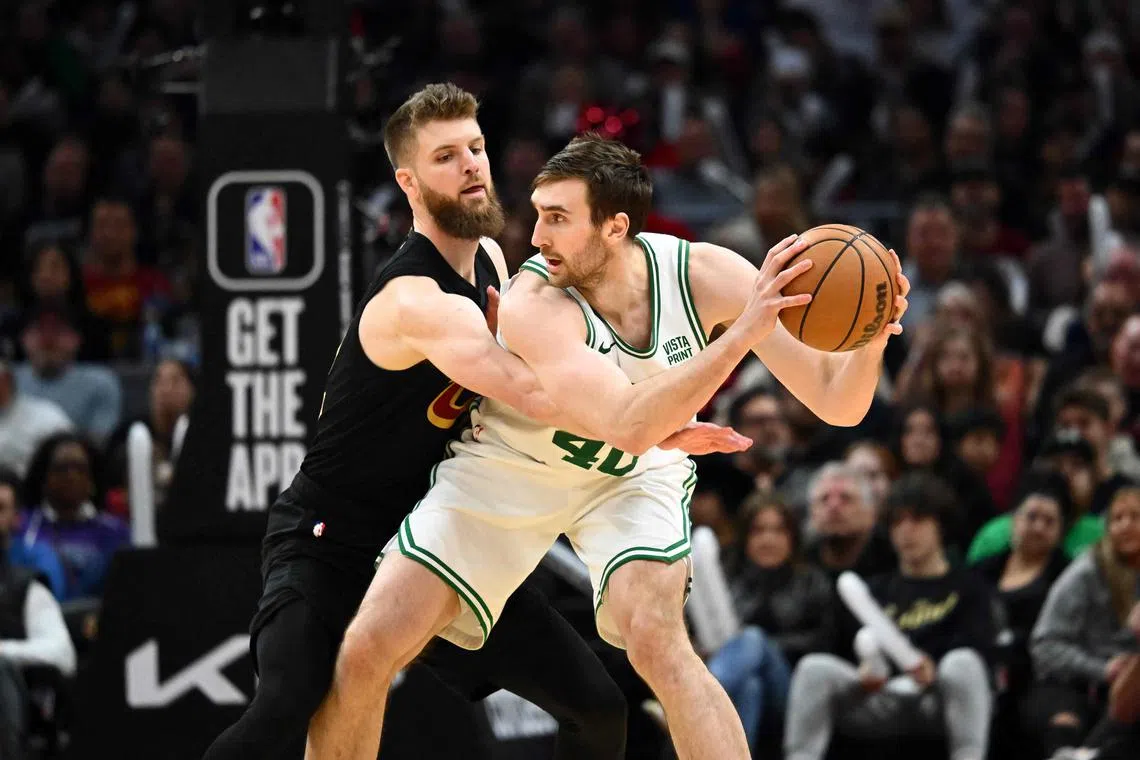 Dean Wade of the Cleveland Cavaliers guards Luke Kornet of the Boston Celtics during the fourth quarter at Rocket Mortgage Fieldhouse.