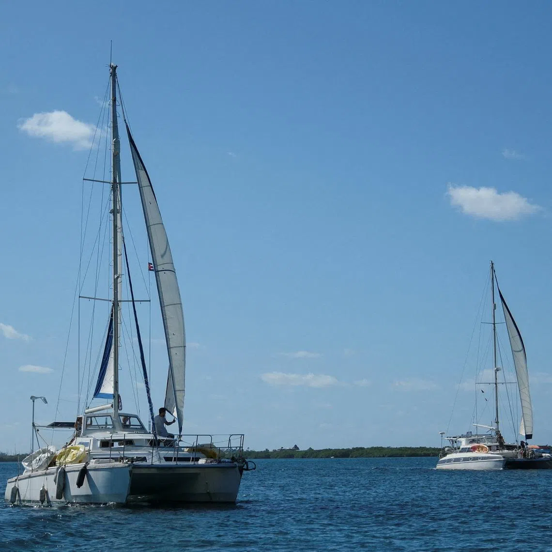 FILE PHOTO: The sailboats Friendship and Tigger Moth, carrying humanitarian aid for Cuba and crewed by activists taking part in the Nuestra America Convoy flotilla, depart Isla Mujeres, Quintana Roo state, Mexico, March 21, 2026. REUTERS/Paola Chiomante/File Photo