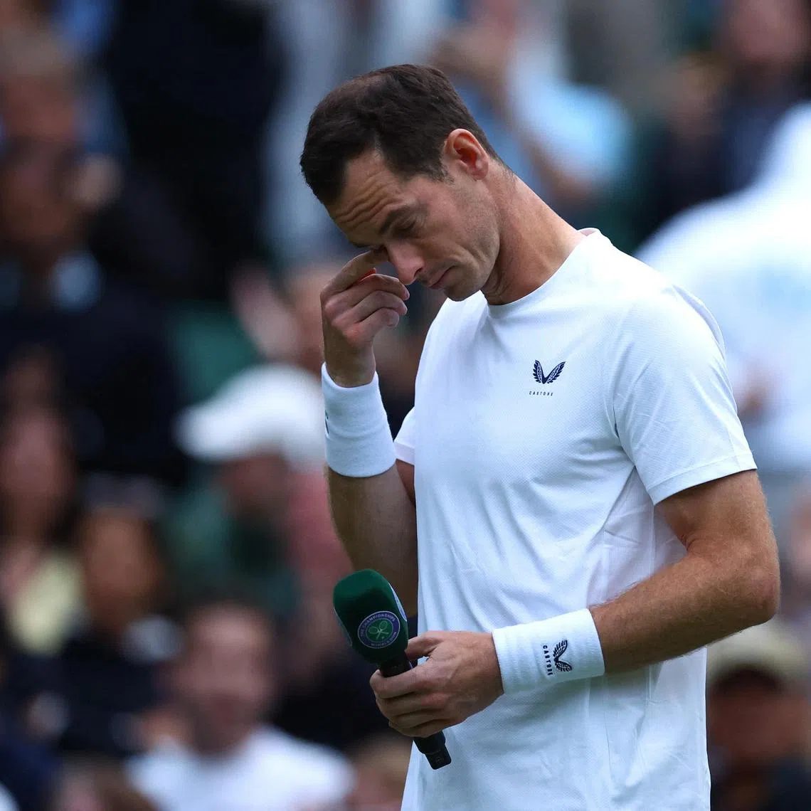 Britain's Andy Murray emotional after losing in the men's doubles first-round Wimbledon match with teammate and brother Jamie on July 4.