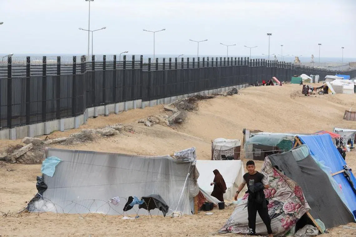 Palestinians shelter at the border with Egypt, amid fears of an exodus of Palestinians into Egypt, as the conflict between Israel and Hamas continues, in Rafah southern Gaza Strip February 16, 2024. REUTERS/Ibraheem Abu Mustafa