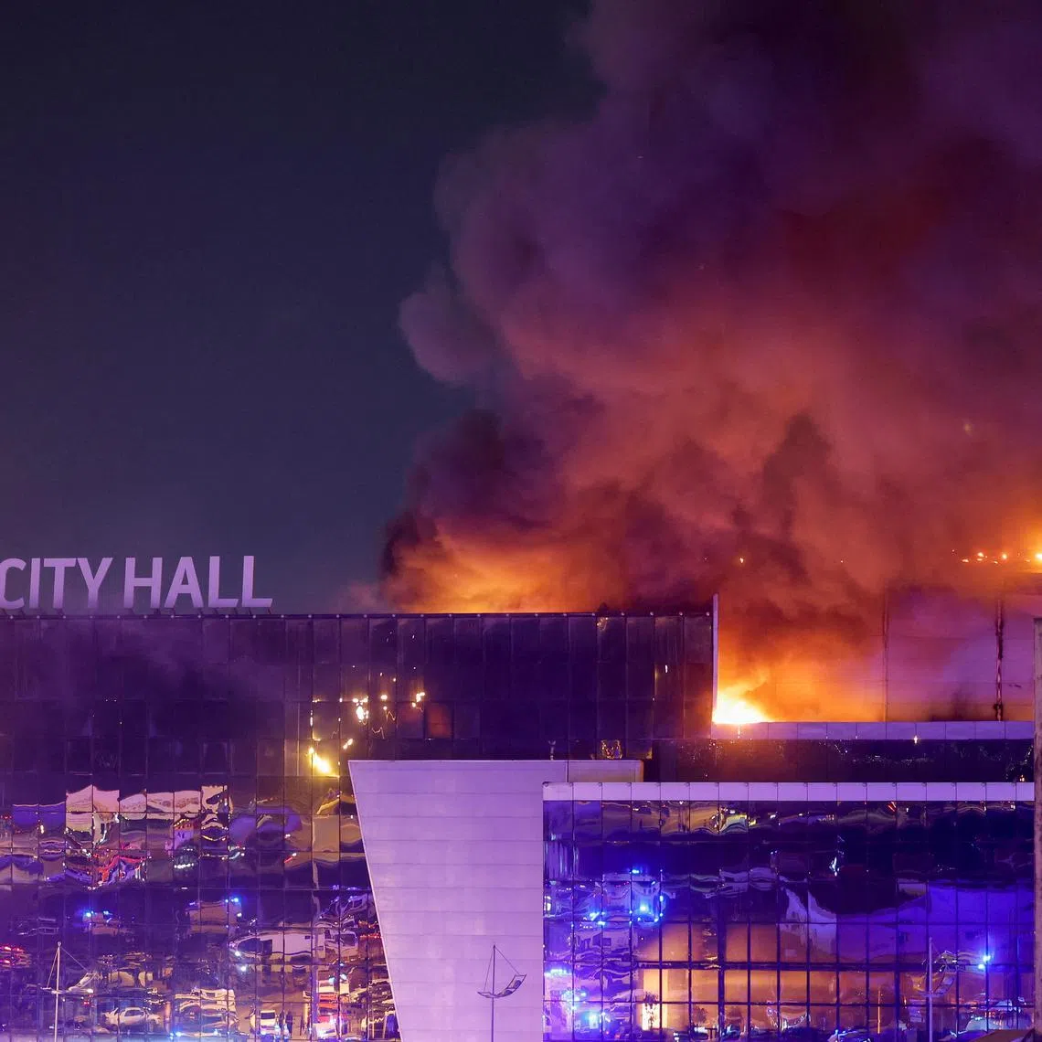 Smoke rises above the burning Crocus City Hall concert venue following a reported shooting incident, outside Moscow, Russia, on March 22.