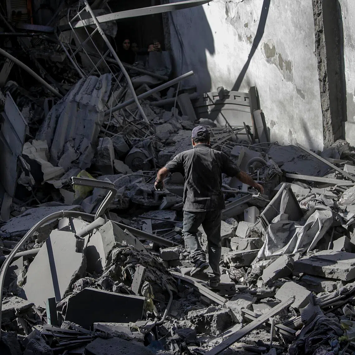 A man surveys the damage to his home following an Israeli airstrike targeting a residential block in Al Shatea refugee camp in Gaza City, on Oct 29, 2025. 