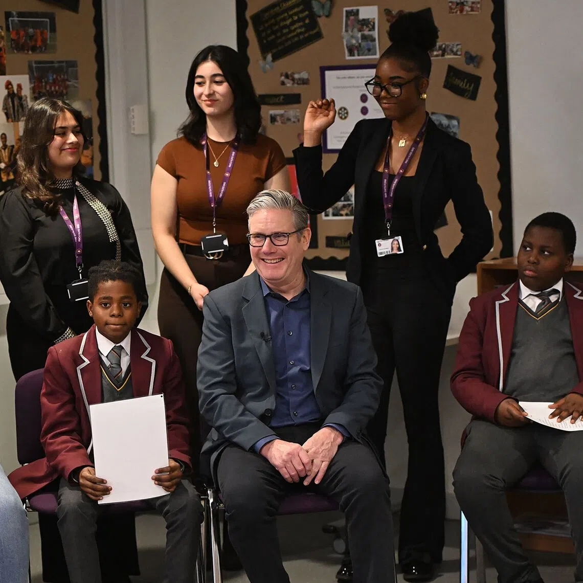 British Prime Minister Keir Starmer (centre) during a visit to St Mary Magdalene school in London to discuss issues surrounding violence against women and girls on Dec 17.