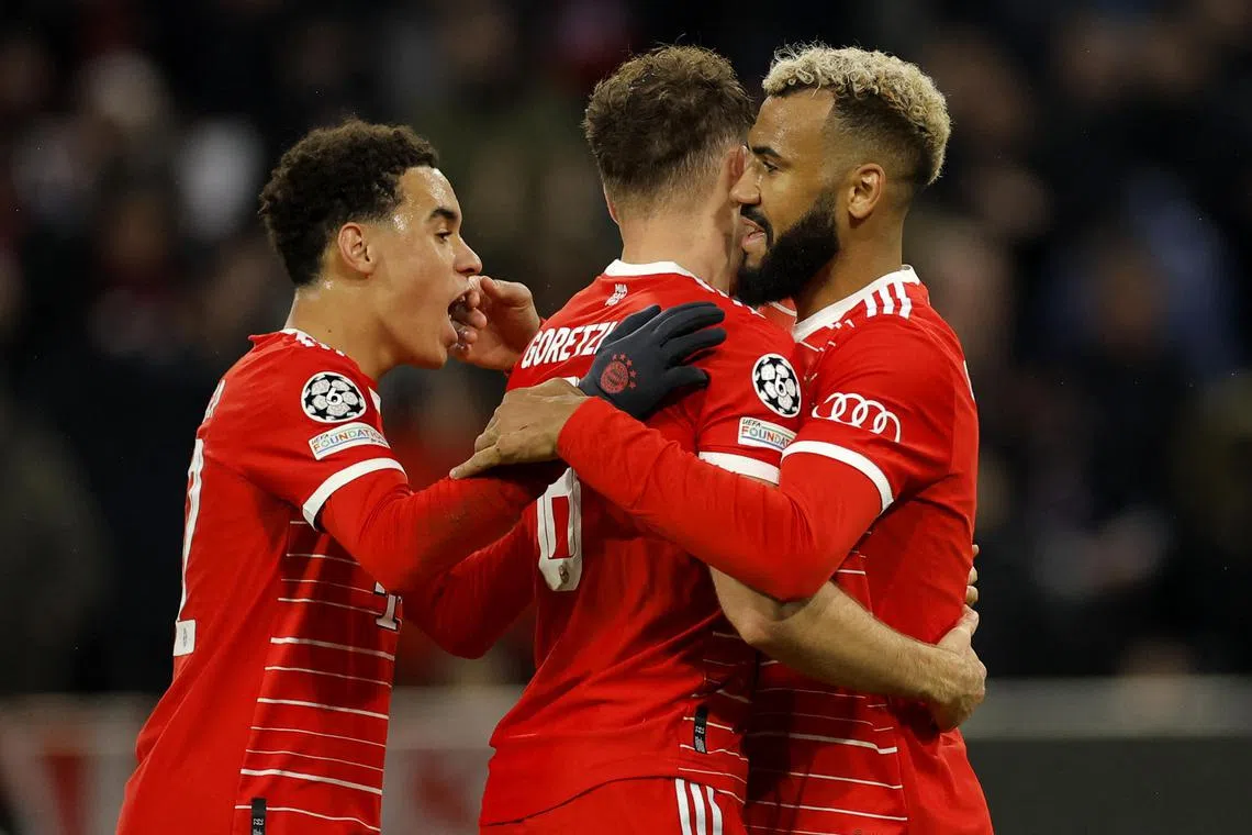 Bayern Munich's Eric Maxim Choupo-Moting (right) celebrates with Leon Goretzka (centre) and Jamal Musiala after scoring the opening goal.