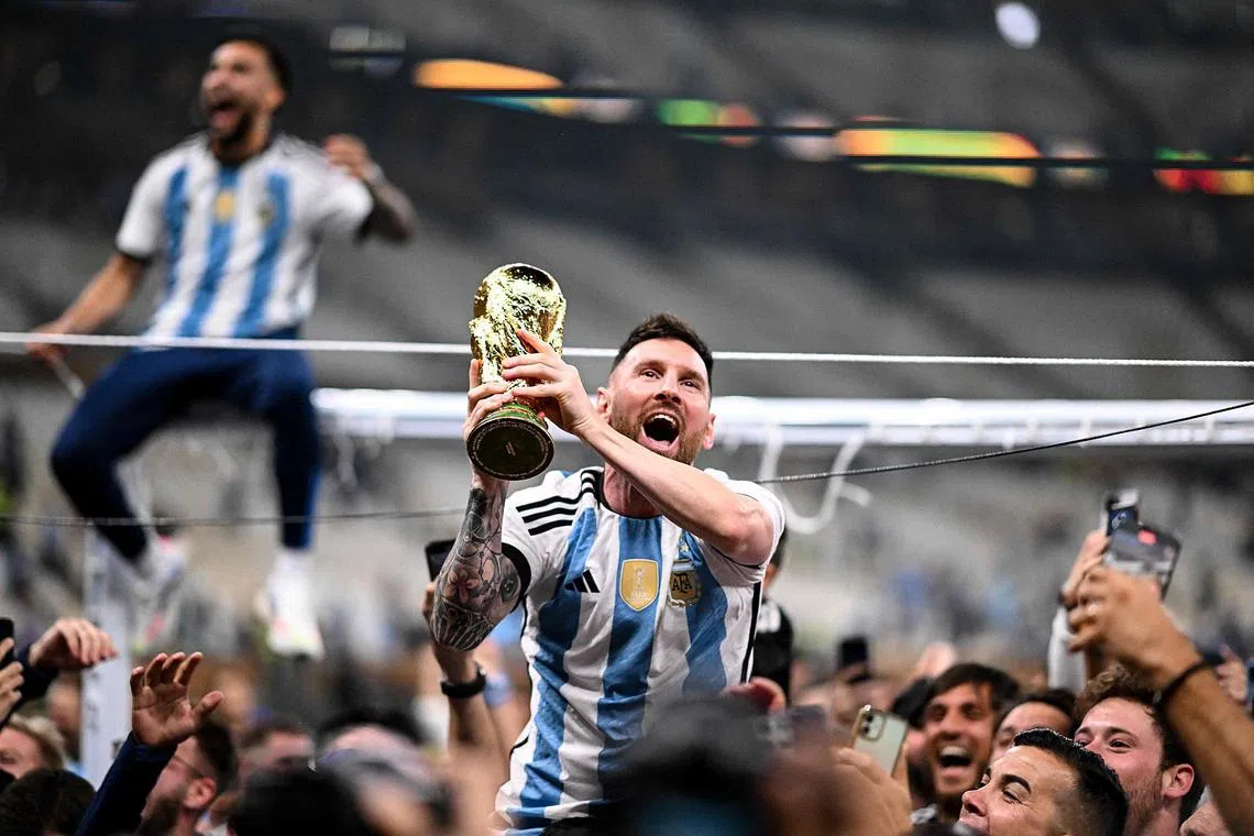 Argentina captain Lionel Messi celebrating with the World Cup trophy after his team defeated France, on Dec 18, 2022.